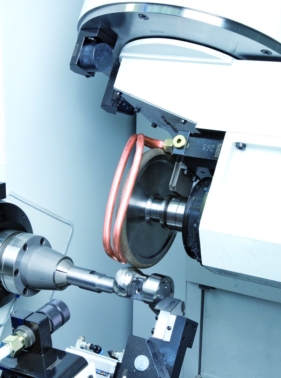 CNC machine tool grinding a joint prosthesis 