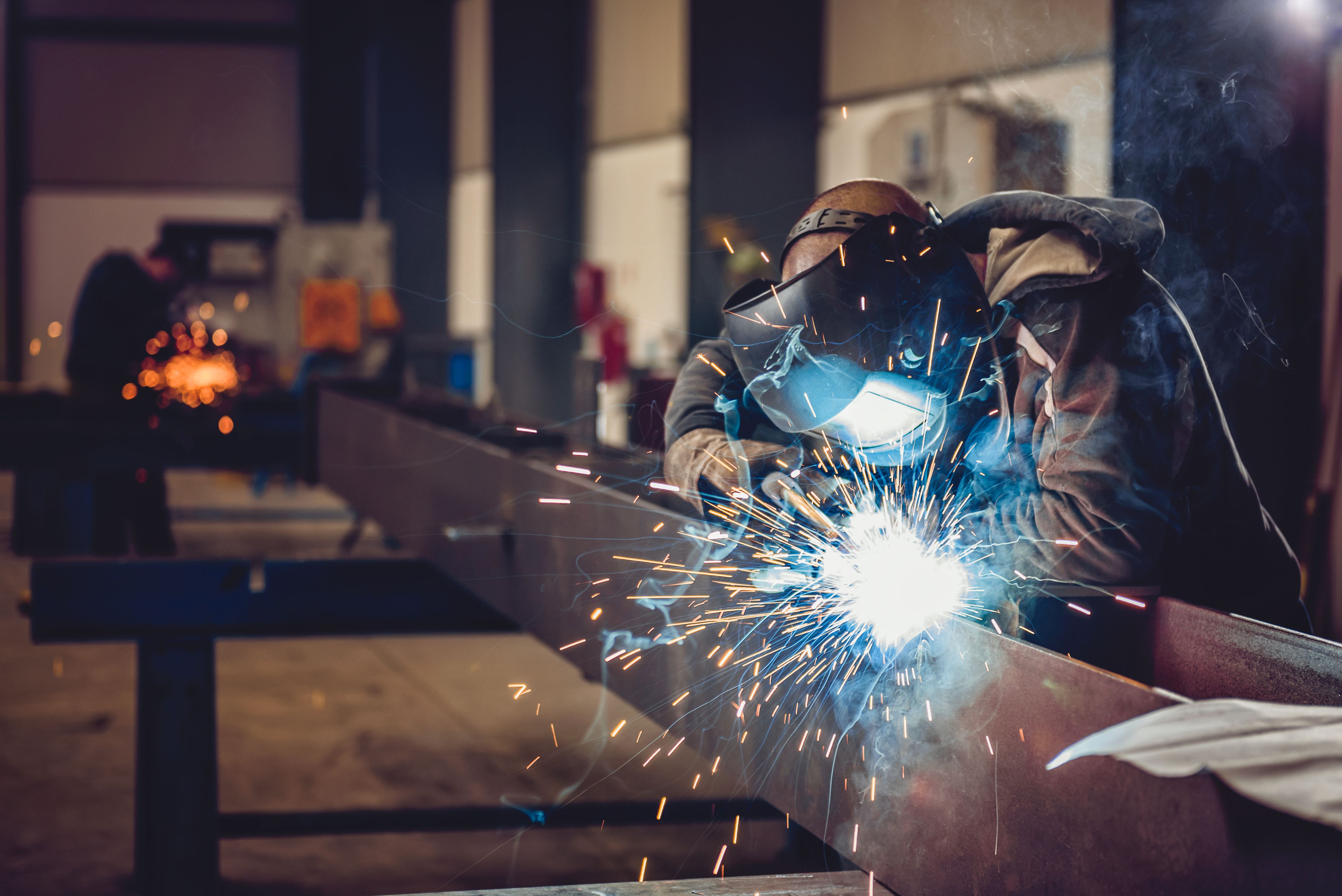 Factory welder working on a welding project