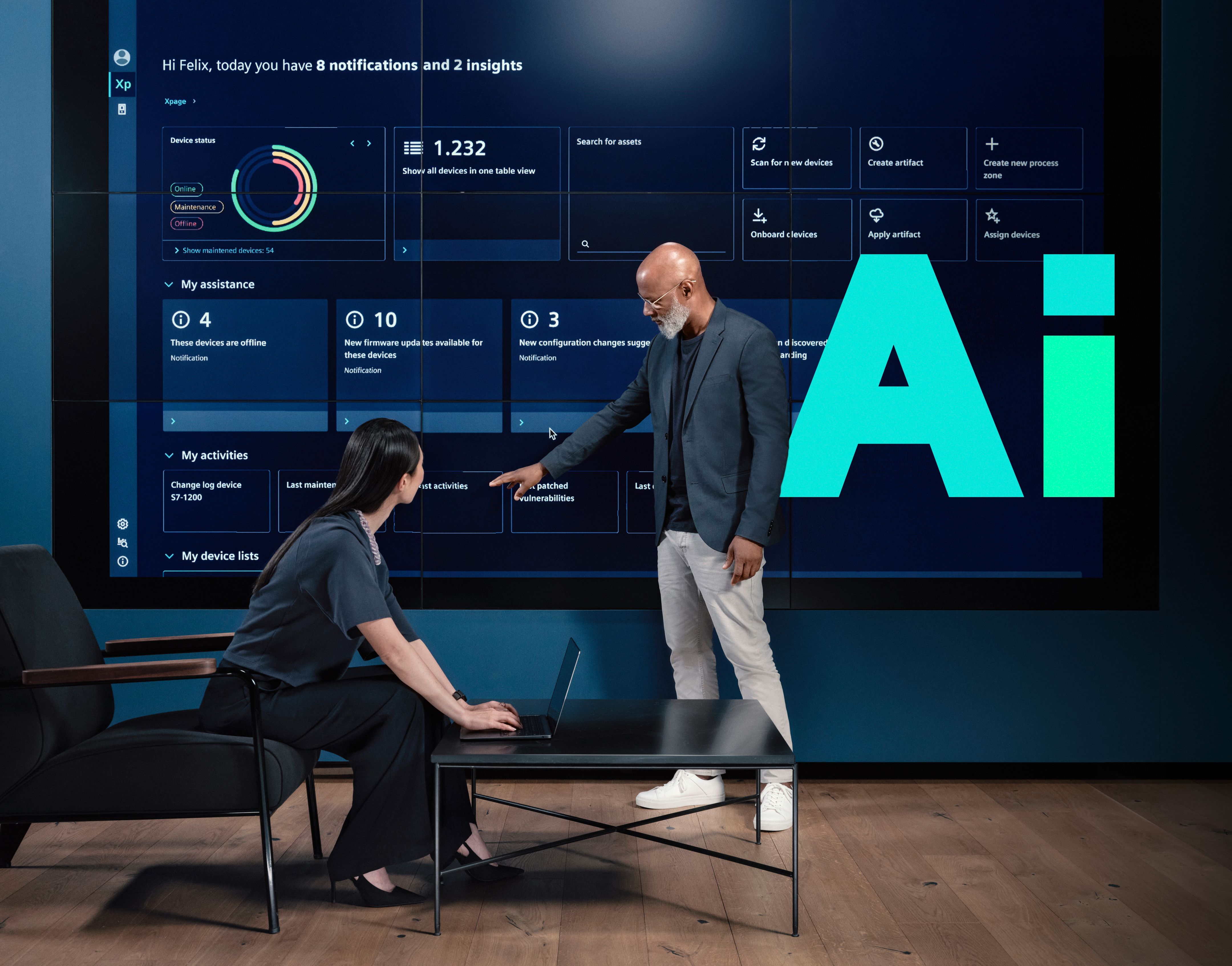 Two people review a large digital dashboard on a wall display with a prominent “AI” graphic.