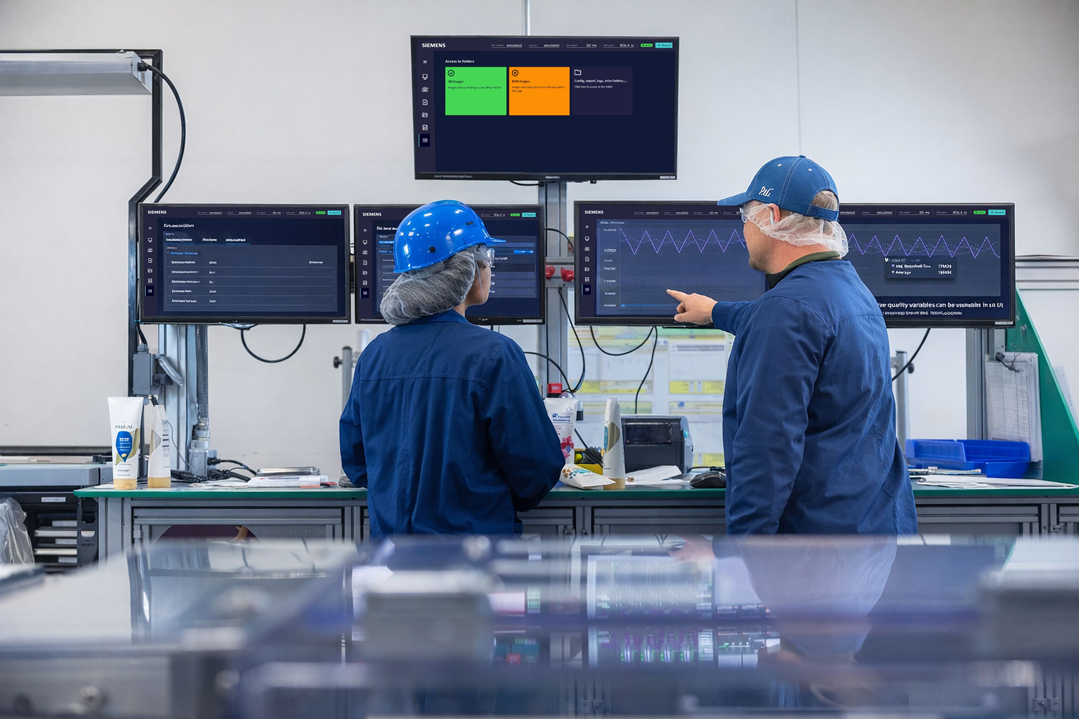 Two Proctor & Gamble technology specialists woking in a manufacturing facility.