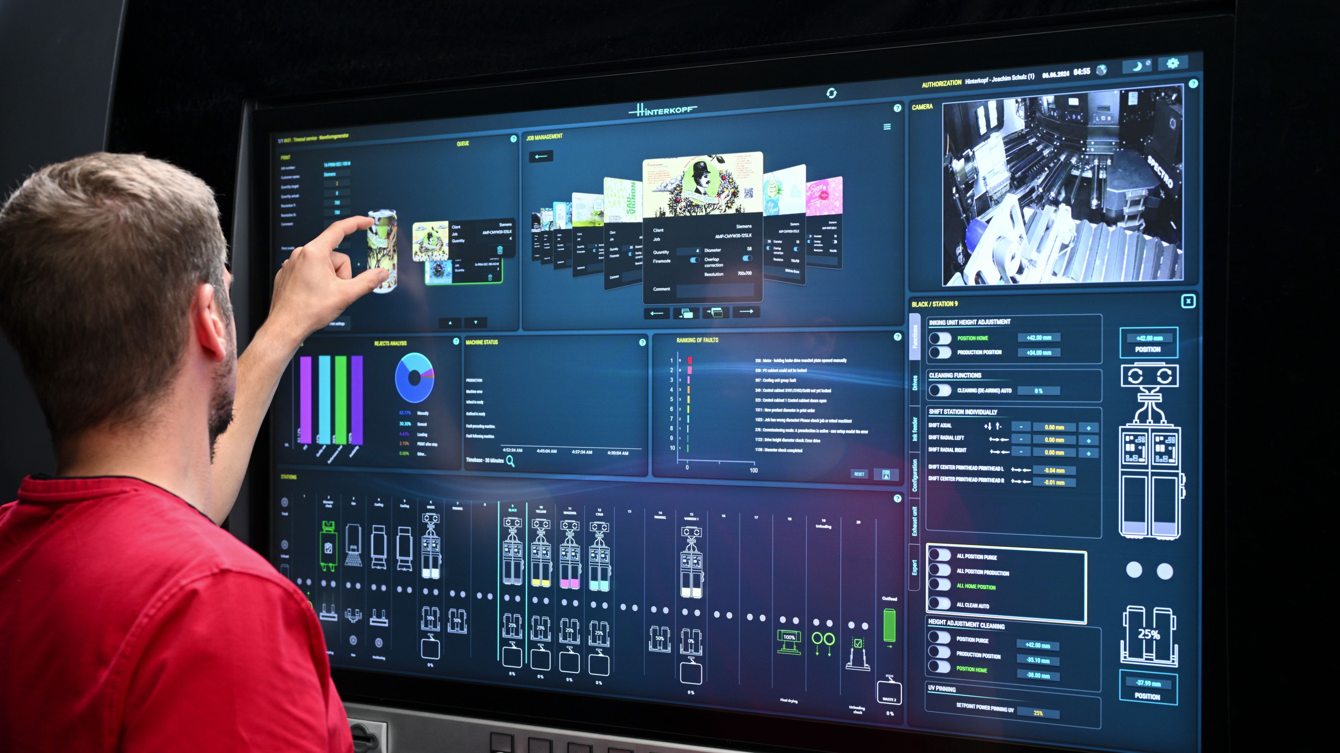 A worker zooming in on a design shown on the 49" screen of the printing press