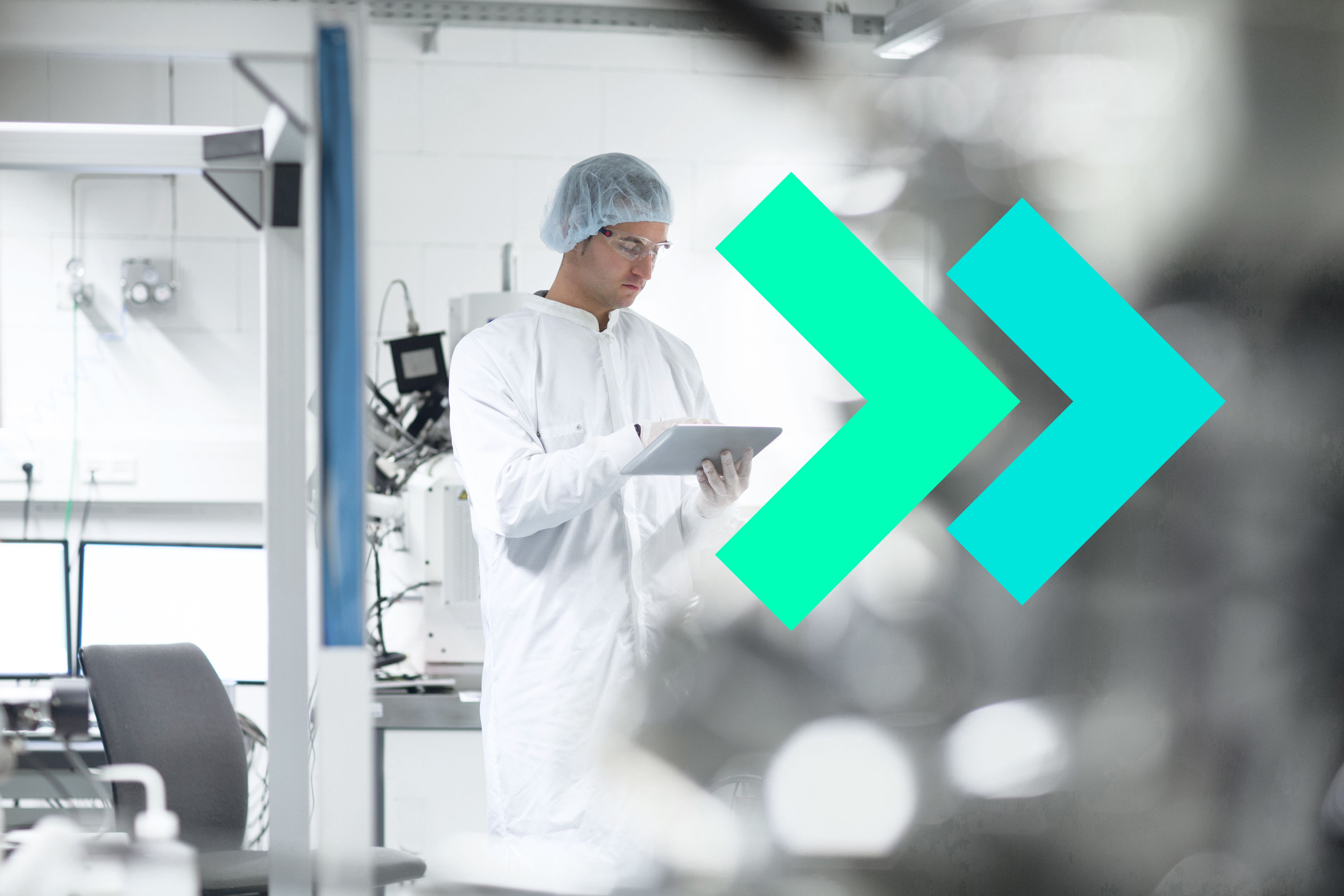 Cleanroom operator using a tablet in a GMP manufacturing facility, with teal arrows symbolizing acceleration.