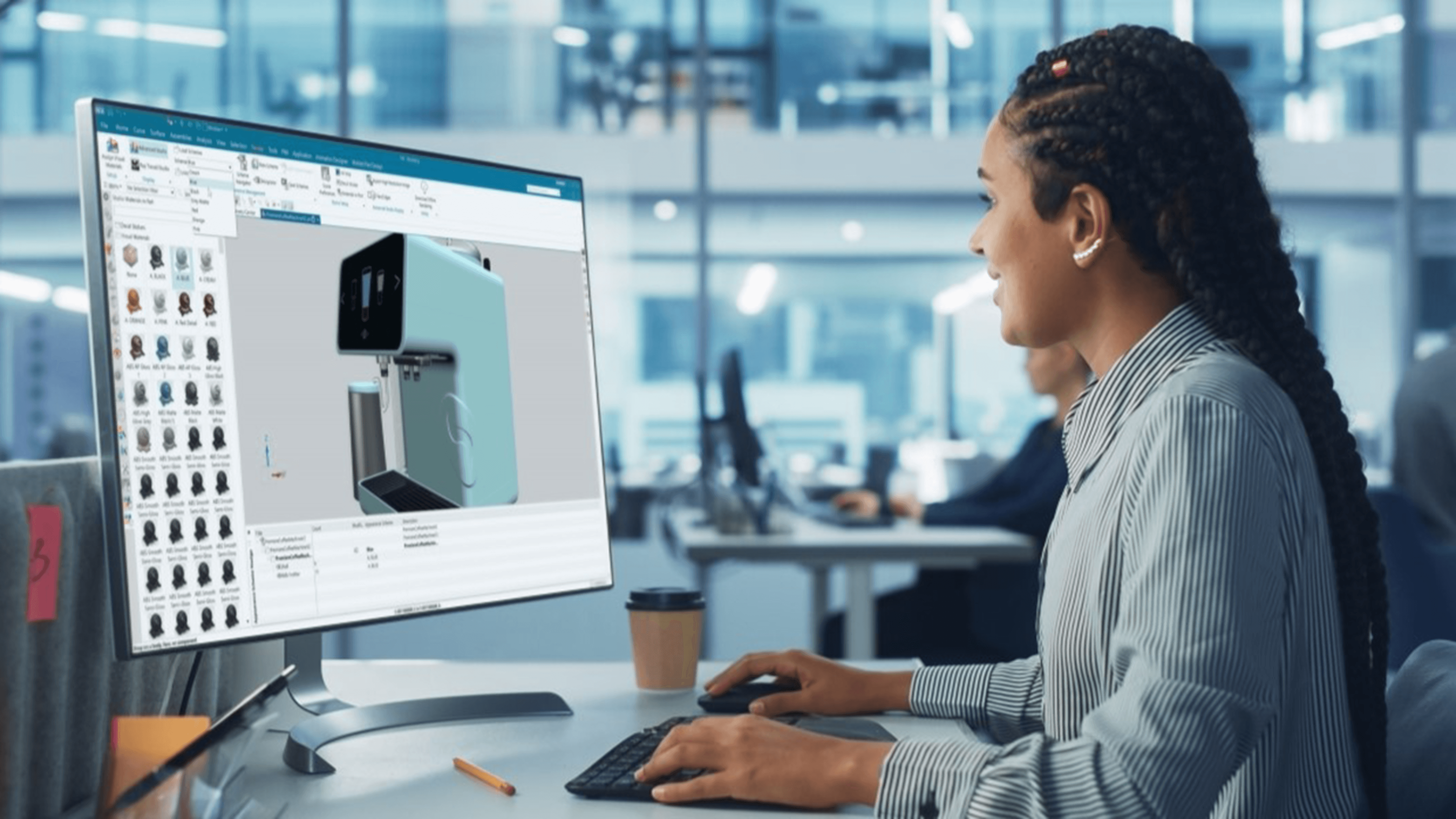 A woman works on a design of a coffee maker in Designcenter.