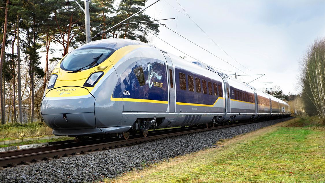 Picture of the Velaro Eurostar e320 from Siemens Mobility in diagonal view driving over a rail track standing for the Velaro high-speed platform.