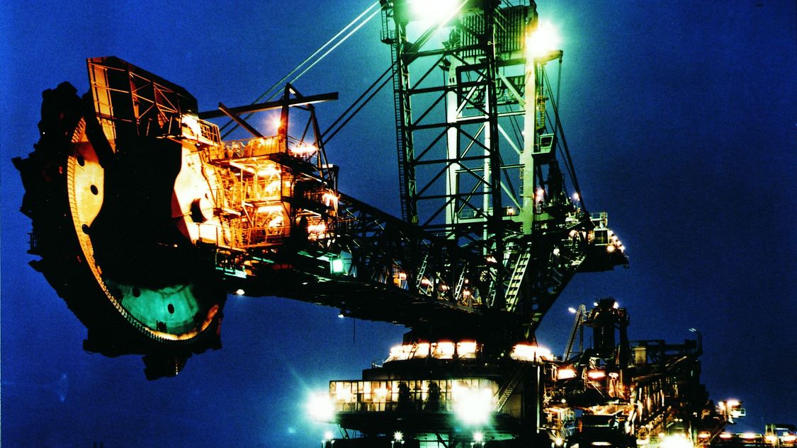 Image of an excavator by night