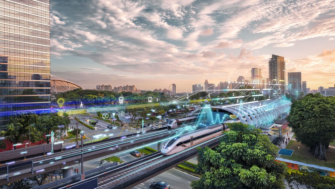 A train pulls into an ultra-modern station in a green, sustainable city; the image is overlaid by digital elements representing smart seamless mobility   