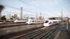 High-speed trains on tracks with city skyline in background transform egypt