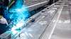 Worker welding Mireo Plus H parts at carbody assembly line 