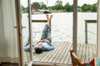 Person lying down on a deck 