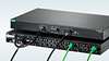 A picture of the RPS2410 Power-over-Ethernet (PoE) power supply attached to the RST2488 layer 2 ethernet switch