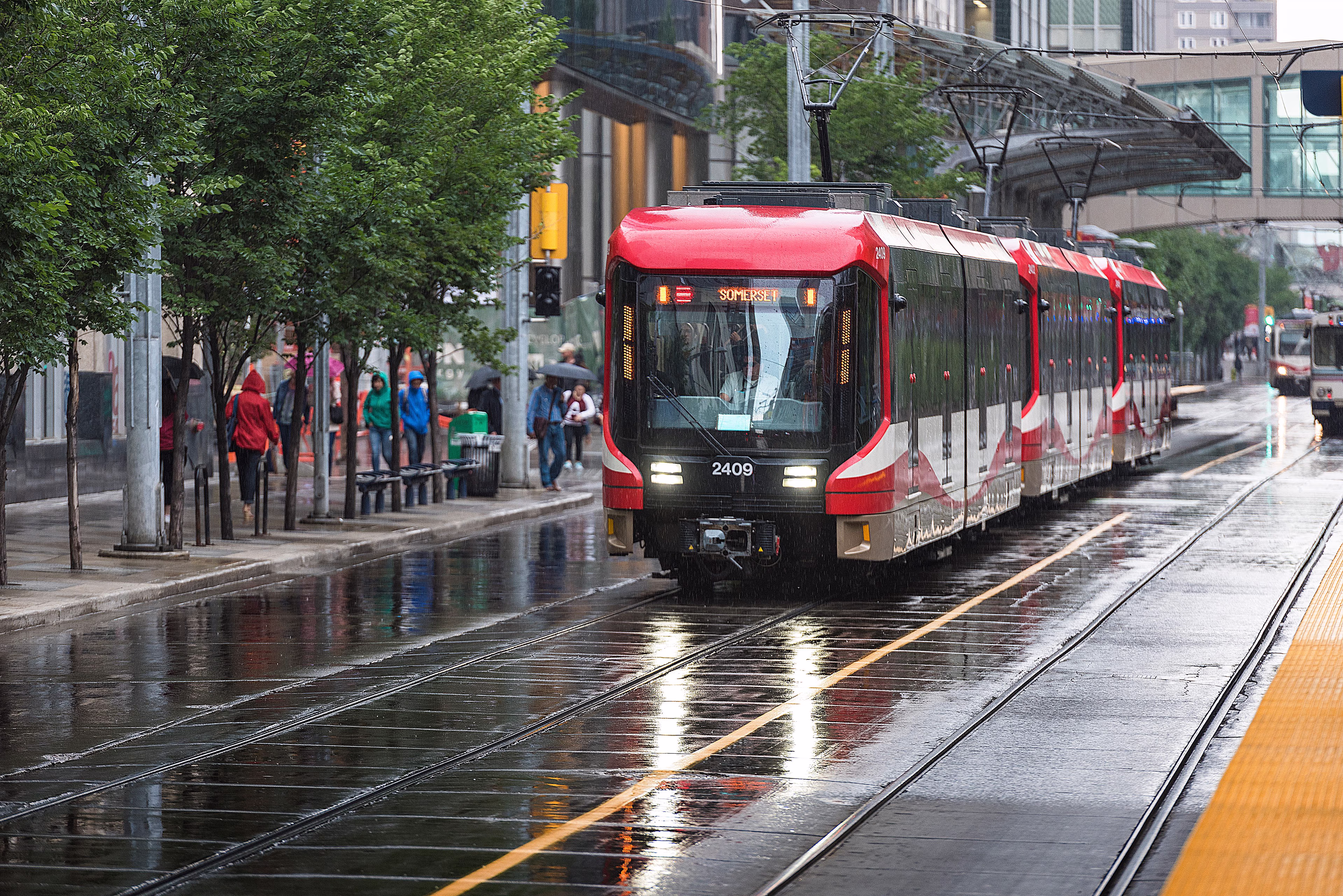 Ca mobility calgary transit train rainy day Calgary Transit Light Rail train rainy day