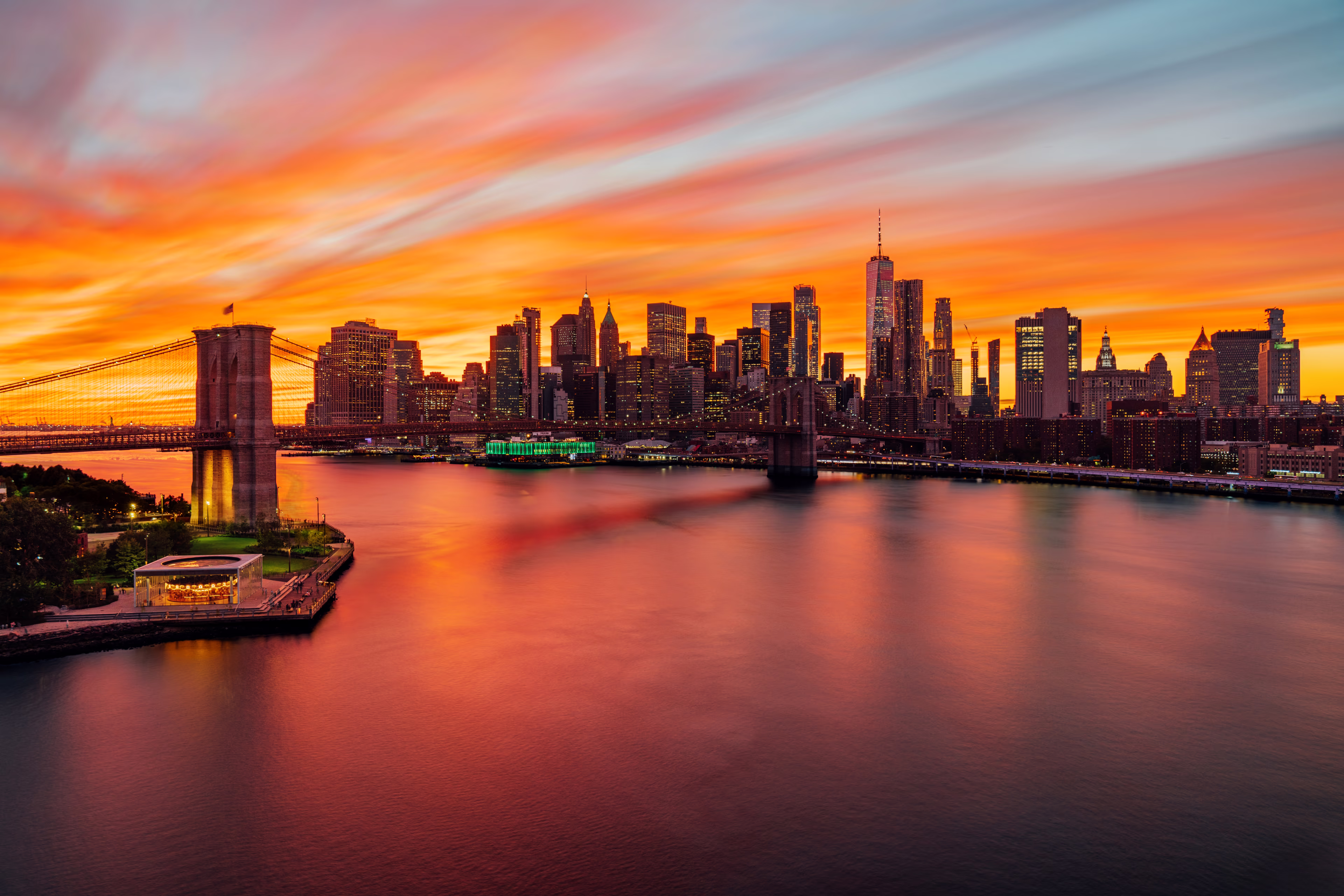 New York City skyline from elevated point of view. Colorful sky at sunset. Manhattan skyline seen from Manhattan Bridge. Brooklyn-Bridge-Skyline