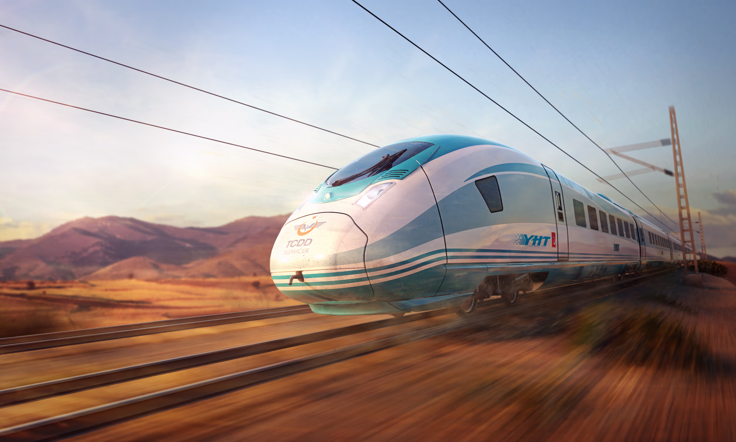 Image of the Velaro TR from Siemens Mobility in diagonal view and slight motion blur driving through a Turkish landscape. Siemens Mobility high-speed train Velaro TR Turkey