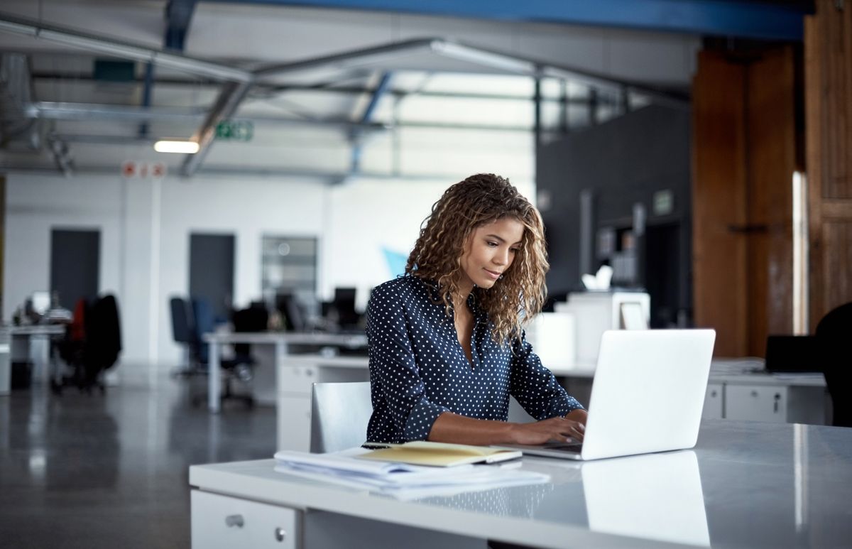 Woman working on laptop in office