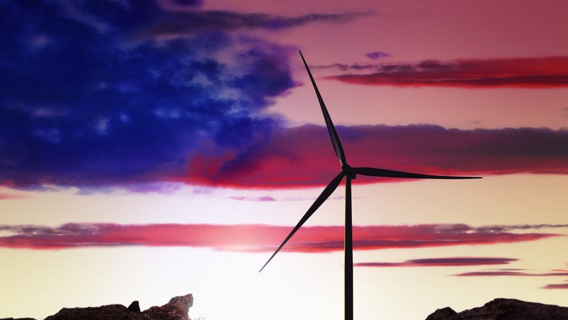 wind turbine with clouds in colors and patten of the US Flag