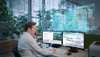 Man using Desigo CC on two monitors.