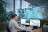 Man using Desigo CC on two monitors.