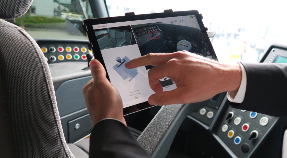 Man in a driver cabin using the Easy Spare IDea app on a tablet to identify a specific spart part