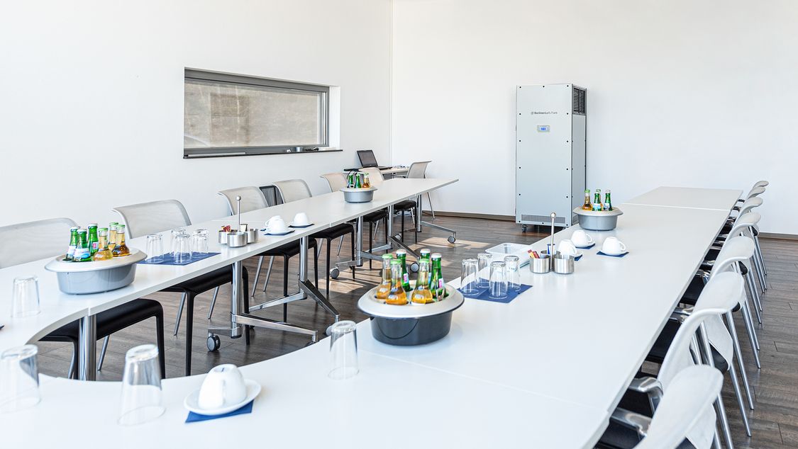 Mobile air sterilizer unit in a meeting room