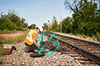 Rail worker working on tracks with digital layer