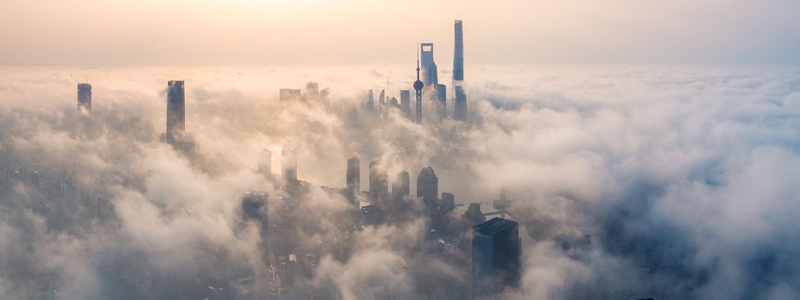 Panoramic view of Shanghai city over the advection fog at sunrise 