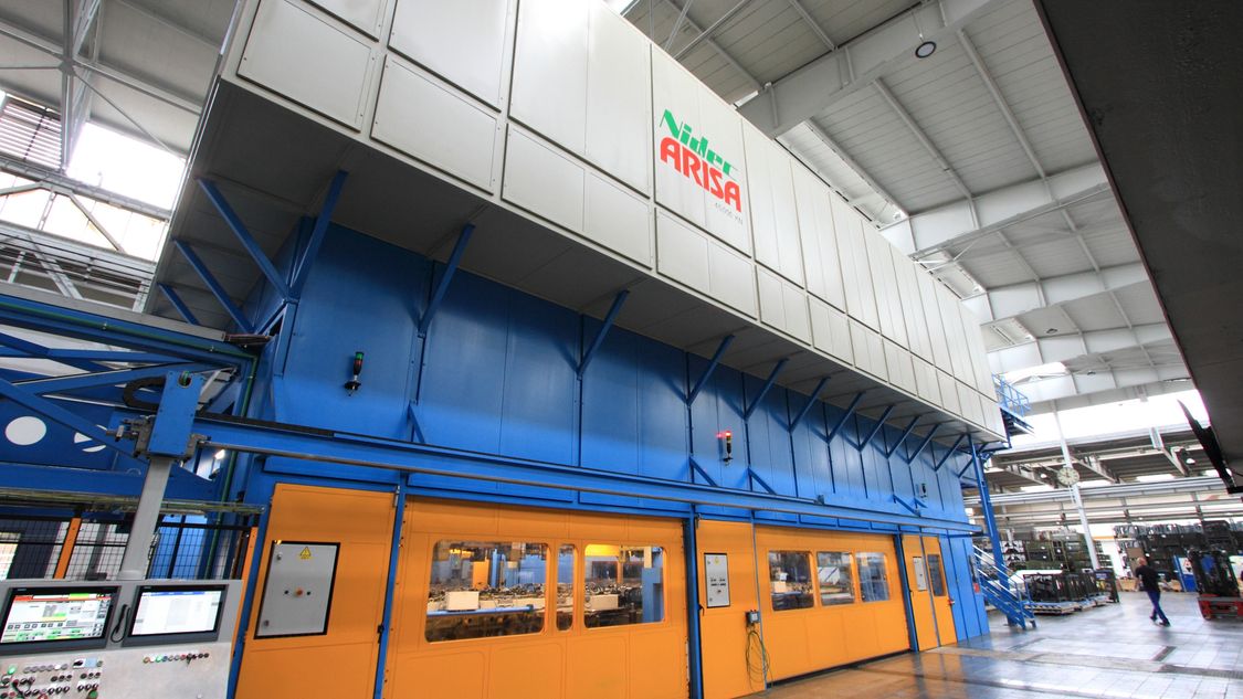 Production hall with Nidec Arisa Logo over the entrance