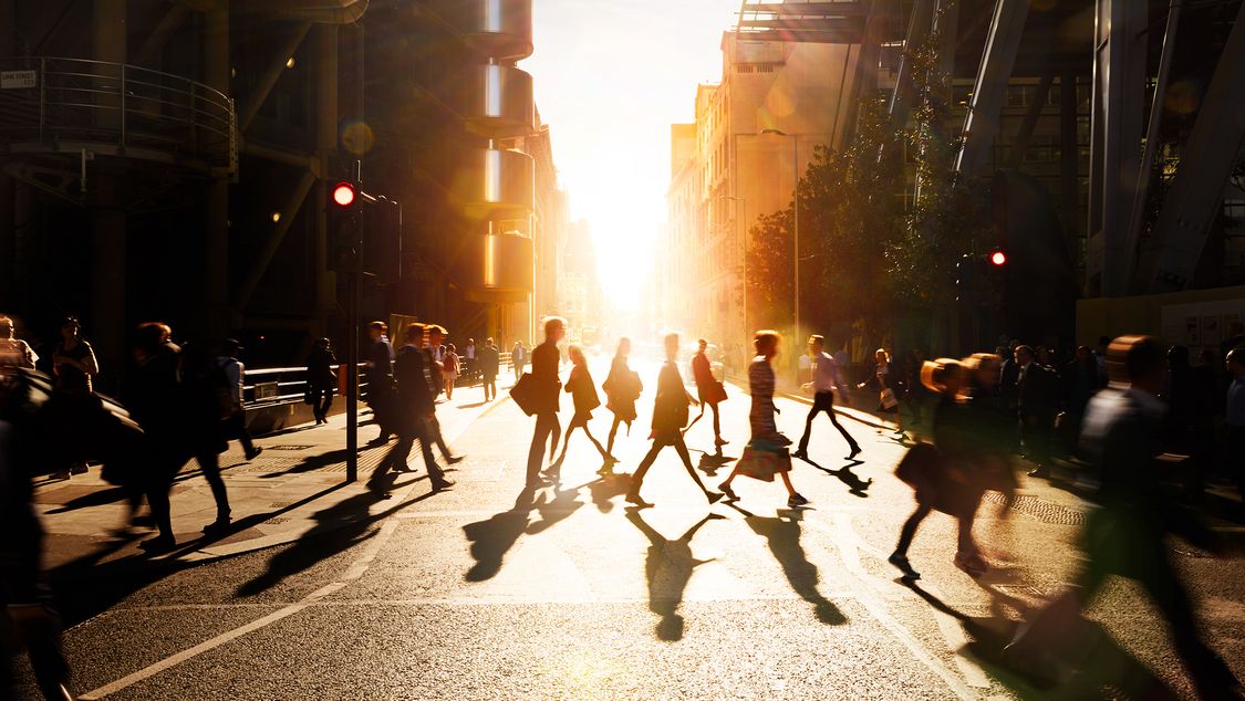 People crossing a street in a city