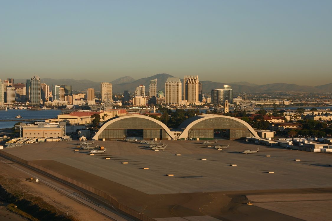 These two hangars are historical landmarks in San Diego. The were built in World War Two for seaplanes. San Diego is in the background.