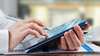 lady holding a tablet looking at finance lease options