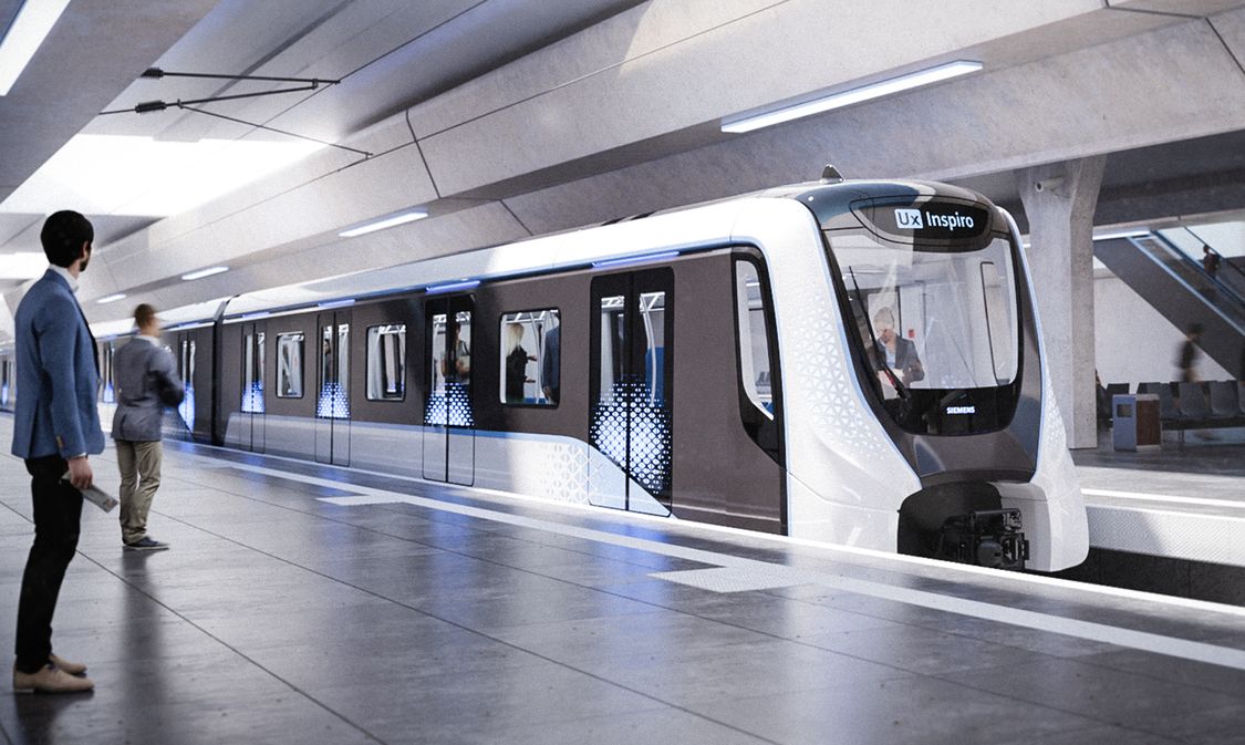 Ein Inspiro Metro Zug von Siemens Mobility hält an einem modernen Metro-Bahnhof. Am Bahnsteig sind Passagiere zu sehen.