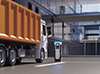 Dump truck at electric vehicle charging station near building Dump truck at electric vehicle charging station near building