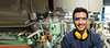 Employee in manufacturing plant with safety gear Employee in manufacturing plant with safety gear