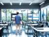 Modern classroom with large screens and person looking at them siemens sce classroom screens person