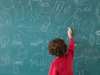 Boy drawing on an blackboard