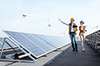 Energy specialists surveying solar panels