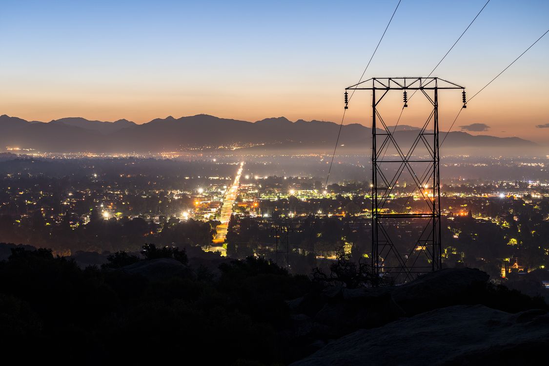 Predawn view of power lines entering the San Fernando Valley in Los Angeles California. The San Gabriel Mountains are in background.