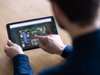 Person using tablet with complex flowchart software on screen SIMATIC PCS neo V6.0