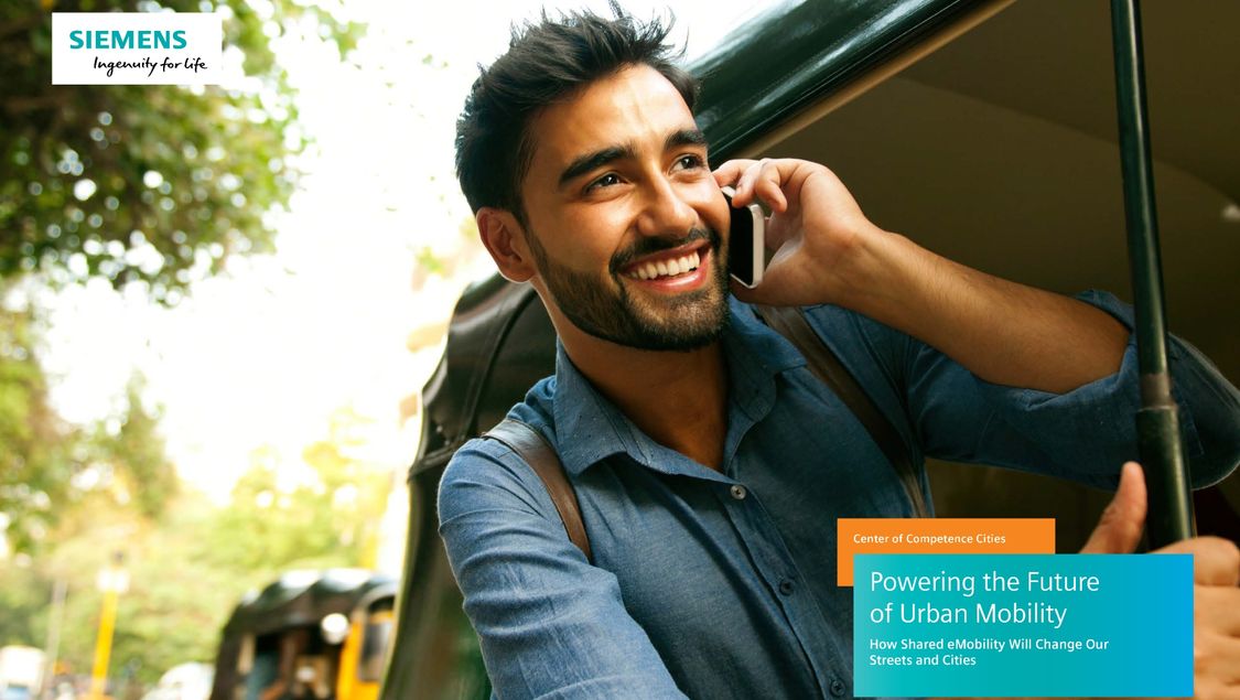Man smiling while talking on cell phone