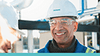 Siemens Employee smiling wearing hard hat