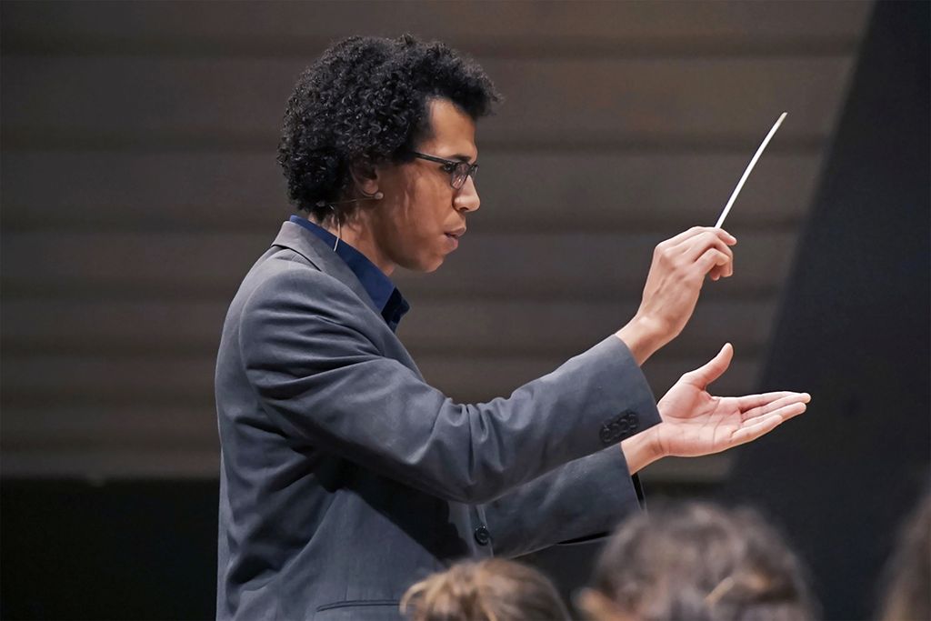 Jonathon Heyward, Assistant Conductor of the Hallé, performing at a concert