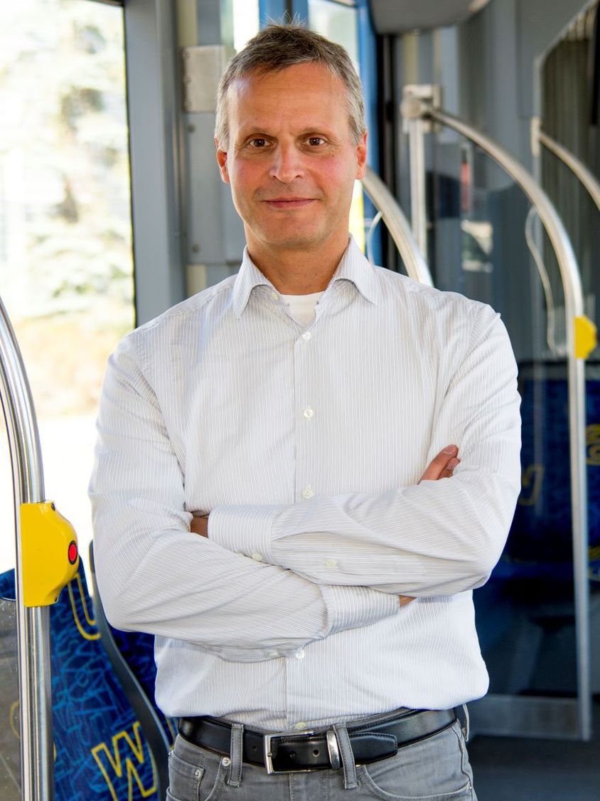 Matthias Hofmann standing in a tram