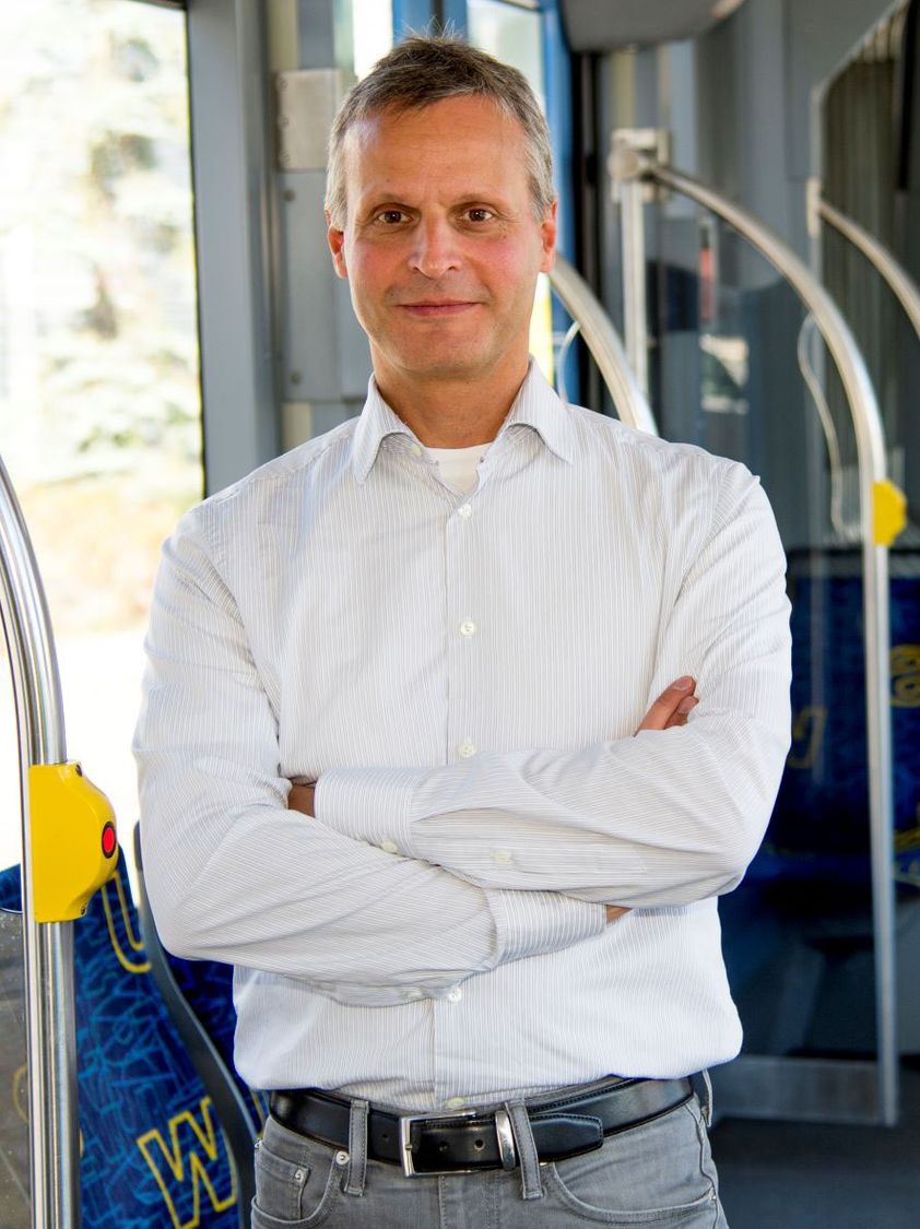 Matthias Hofmann standing in a tram