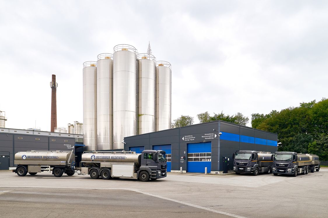 Trucks in front of a milk factory
