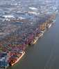 Aerial view of bustling port with cargo ships and containers Aerial view of bustling port with cargo ships and containers