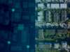 Aerial view of city buildings with digital overlay acerez