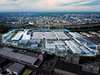 Aerial view of futuristic building complex with digital overlay
