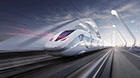 Picture of the Velaro Novo from Siemens Mobility in diagonal view from behind with slight motion blur effects driving over a bridge.