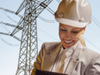 Woman with tablet computer in front of a power grid protection-data-manager-key-visual
