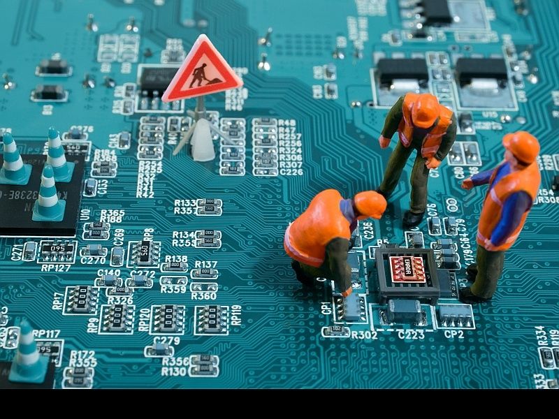Mini workers on circuit board