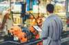 Worker oversees production line. Worker oversees production line.